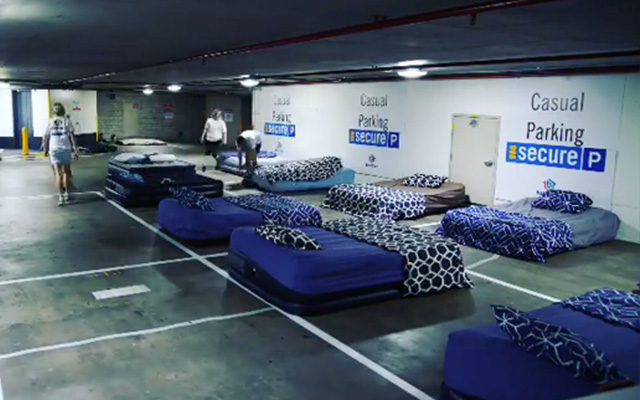 Car Park with Beds Aligned for the Homeless - Donating a Mattress - Beddown
