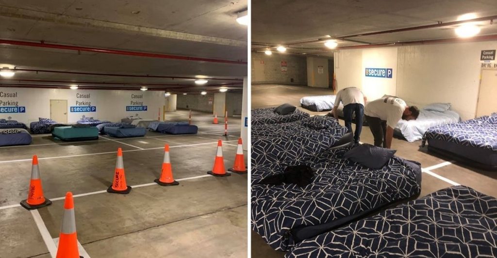 Parking Lot Arranged with Beds for Homeless Guests - Volunteer Homeless Shelter - Beddown