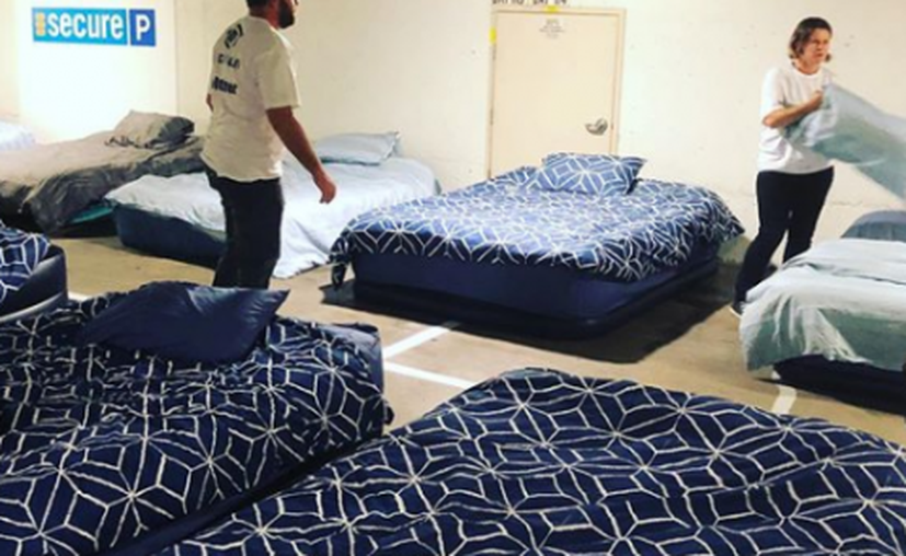 Volunteer Fixing Beds for Guests - Charities For the Homeless - Beddown