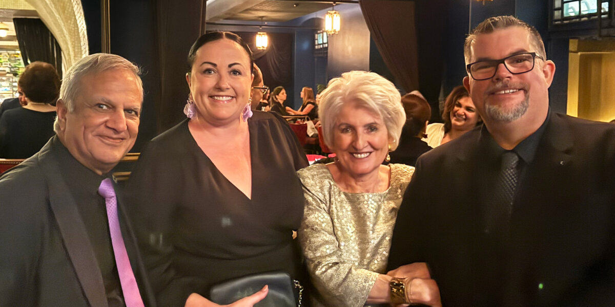 AMA Queensland Foundation Dr Dilip Dhupelia and his wife Mrs Ann Dhupelia with Deputy CEO Nerissa Wade and CEO Paul Tommasini standing together at event.