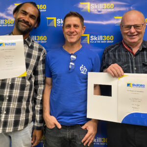 Bedding Down Careers Program Graduates Brian and Daniel smiling with their certificates with Beddown Team Member Ben